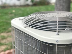 hvac-unit-outside-near-green-grass